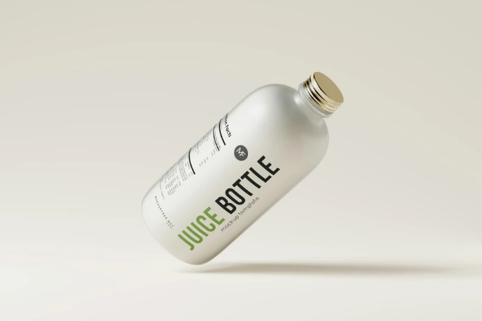 a bottle of juice is flying through the air